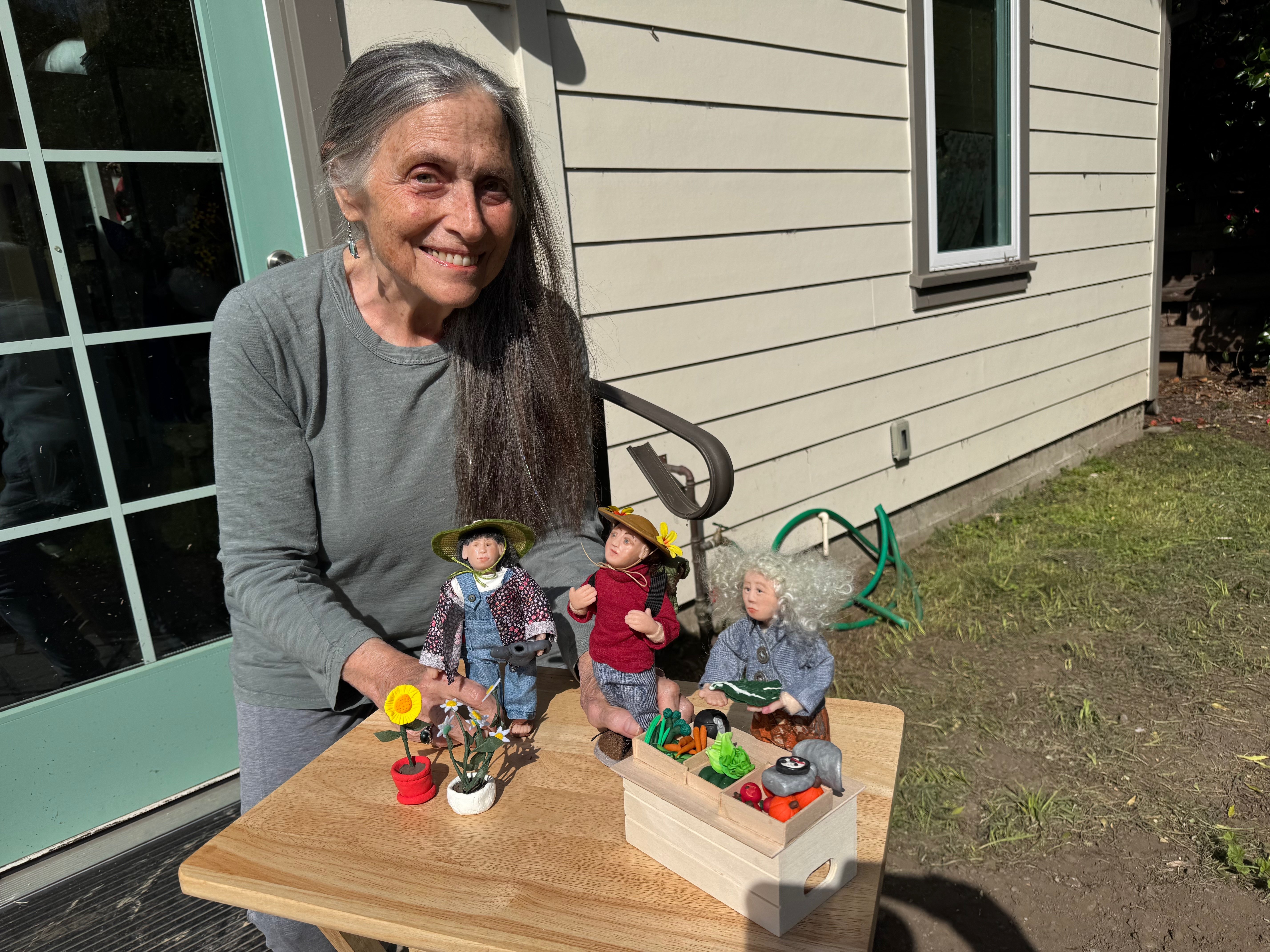 Donna with her handcrafted dolls